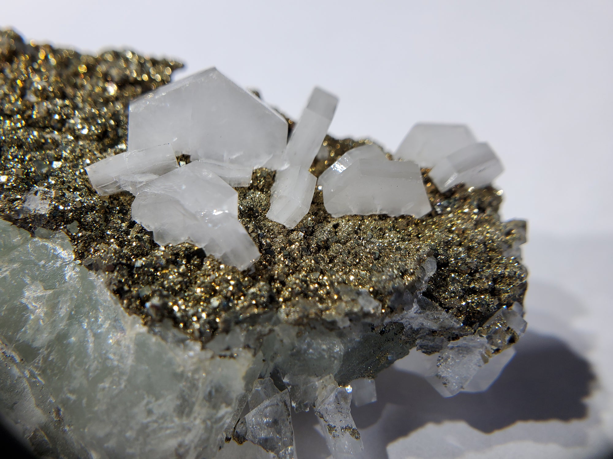 Calcite and Pyrite on Fluorite