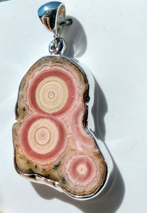 Rhodochrosite stalactite slice pendant