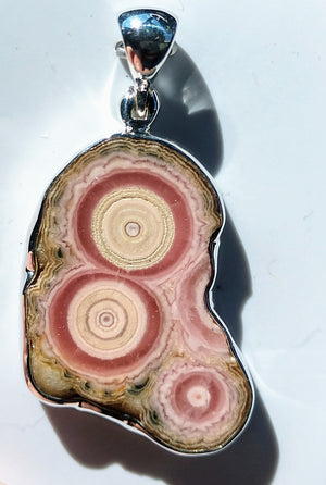 Rhodochrosite stalactite slice pendant