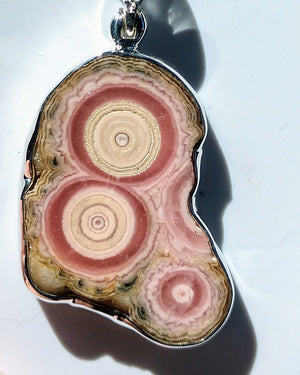 Rhodochrosite stalactite slice pendant